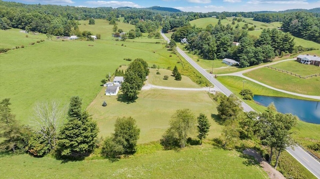 drone / aerial view featuring a rural view and a water view