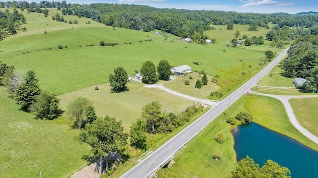 drone / aerial view with a water view and a rural view