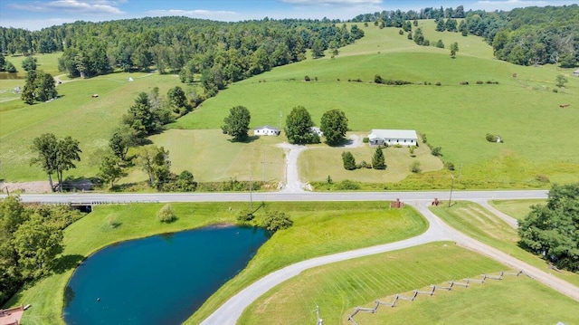 drone / aerial view featuring a water view and a rural view