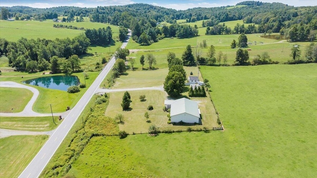 drone / aerial view featuring a rural view and a water view