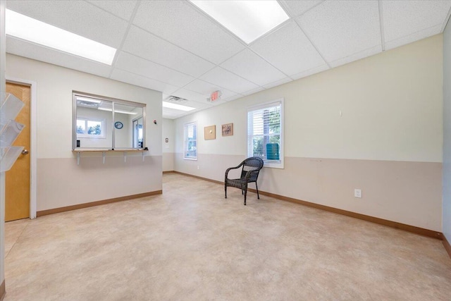 interior space featuring a paneled ceiling