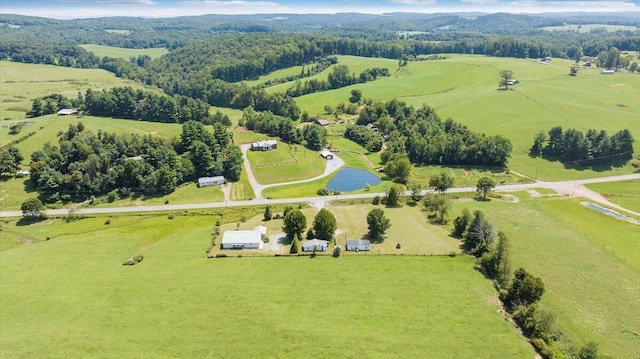 aerial view with a rural view and a water view