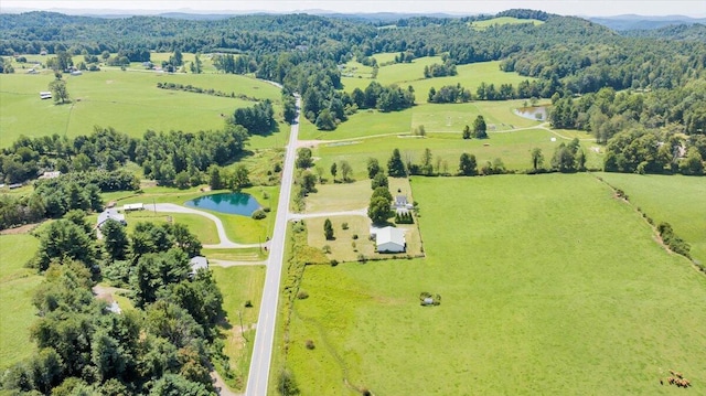 drone / aerial view with a rural view and a water view