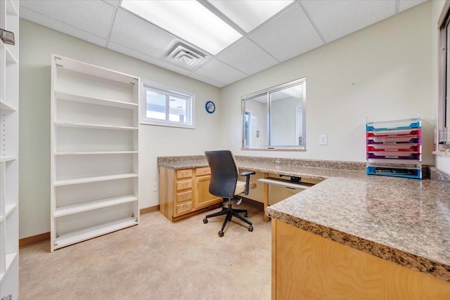 office area featuring a paneled ceiling and light carpet