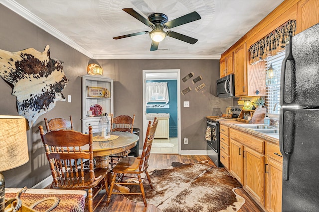 kitchen featuring crown molding, radiator heating unit, dark hardwood / wood-style floors, and appliances with stainless steel finishes