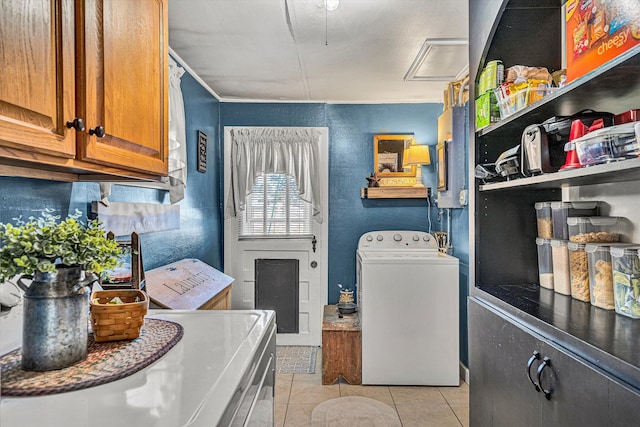 washroom featuring washer / dryer and light tile patterned floors