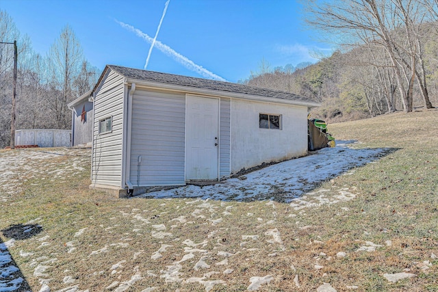 view of outdoor structure featuring a yard