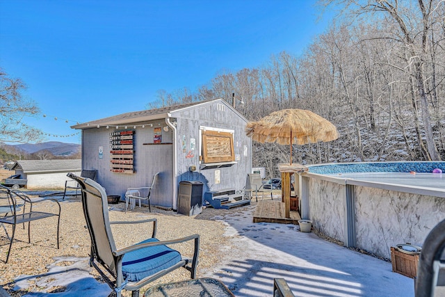 exterior space with an outbuilding and a mountain view