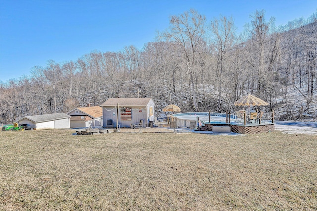 view of yard with a gazebo and an outdoor structure