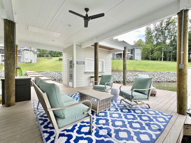 deck featuring a lawn, an outdoor hangout area, and ceiling fan