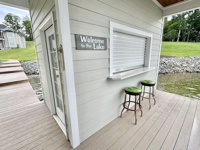 wooden deck with a lawn