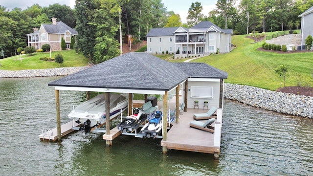 dock area with a yard and a water view