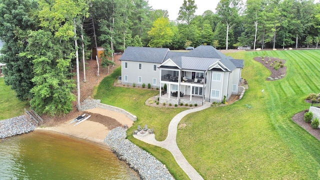 birds eye view of property featuring a water view