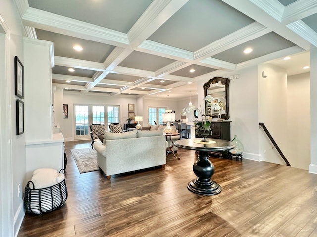 living room with hardwood / wood-style floors, crown molding, beam ceiling, and coffered ceiling
