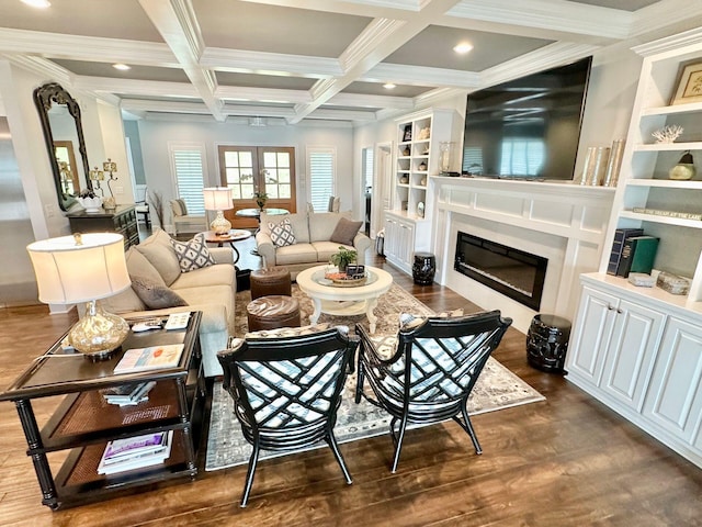 living room with dark hardwood / wood-style flooring, built in features, ornamental molding, beam ceiling, and coffered ceiling