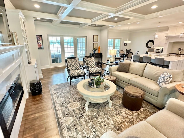living room featuring coffered ceiling, beamed ceiling, crown molding, and dark wood-type flooring