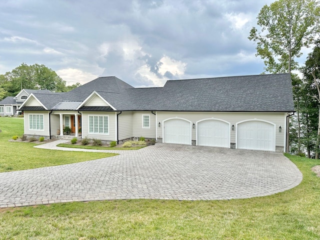 ranch-style house with a garage and a front lawn