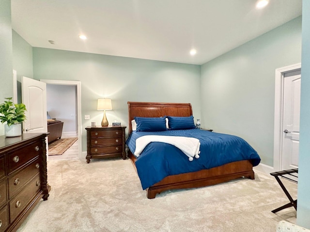 carpeted bedroom with ensuite bathroom