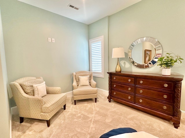 living area with light colored carpet