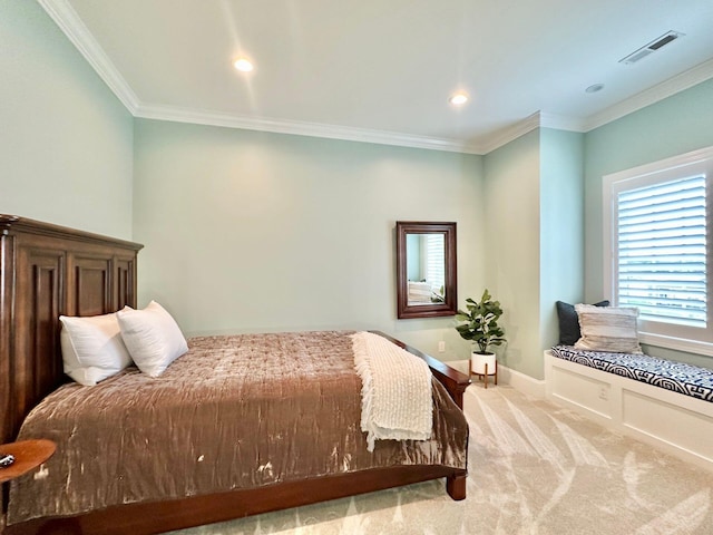 bedroom featuring crown molding and carpet