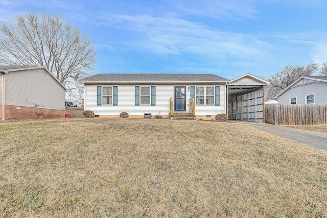 view of front of home with a front yard and a carport