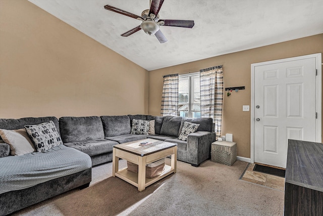 living room featuring ceiling fan, light colored carpet, and lofted ceiling