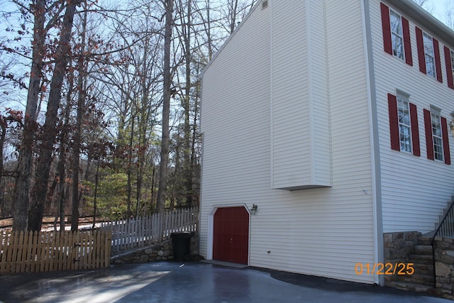 view of side of property with a garage