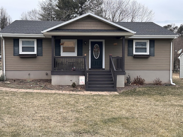 view of front of house with a front yard and a porch