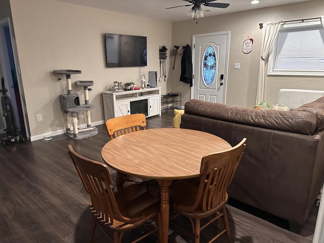 dining area featuring ceiling fan and dark hardwood / wood-style floors