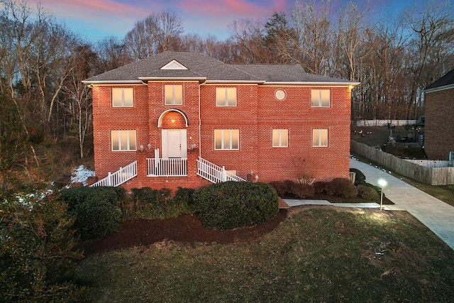 view of front of property with a yard