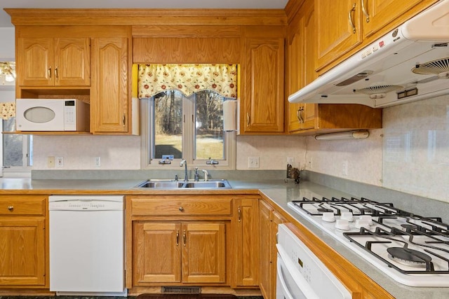 kitchen featuring sink and white appliances