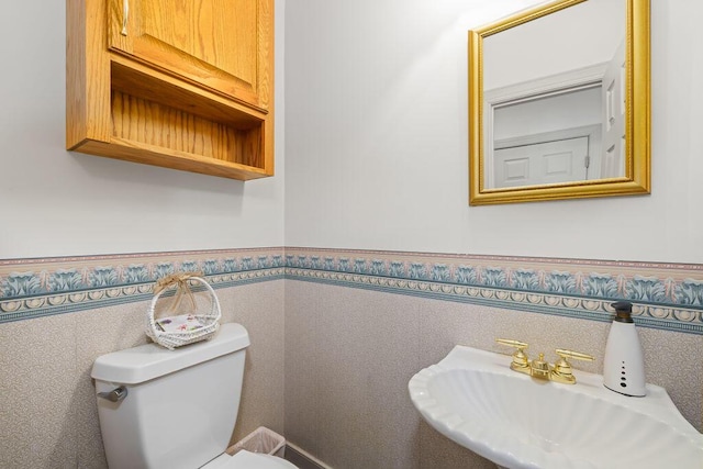 bathroom featuring sink and toilet