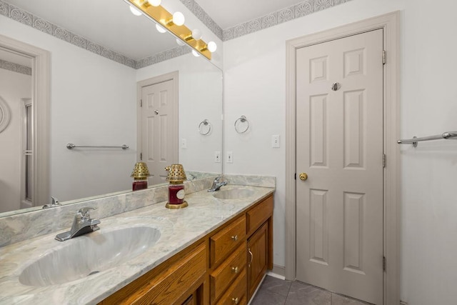 bathroom featuring tile patterned flooring and vanity