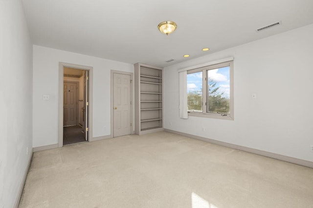 unfurnished bedroom with light carpet