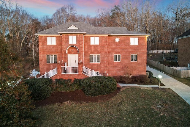 view of front of home with a lawn