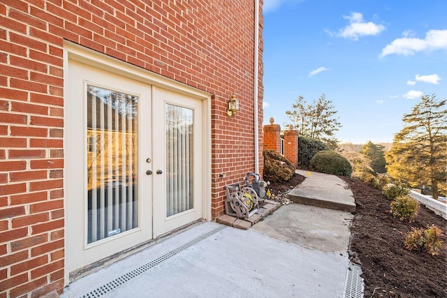 doorway to property with a patio area and french doors