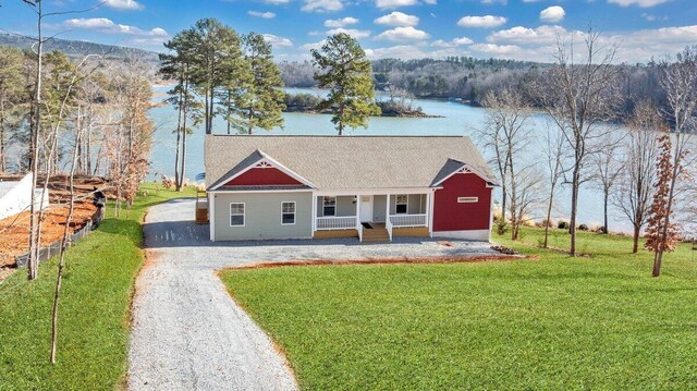 birds eye view of property with a water and mountain view