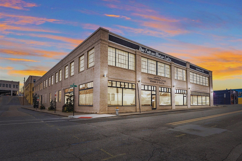 view of outdoor building at dusk