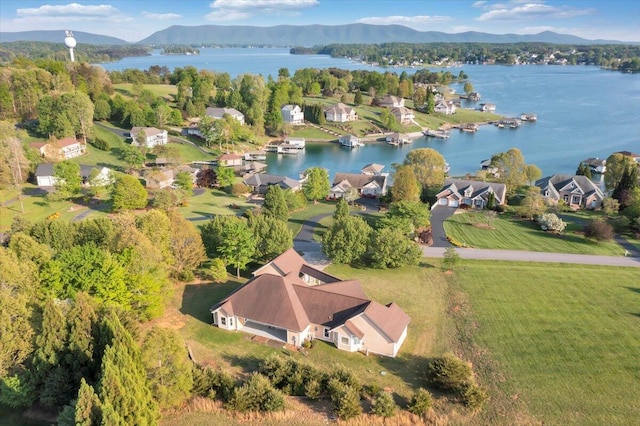 aerial view featuring a water and mountain view