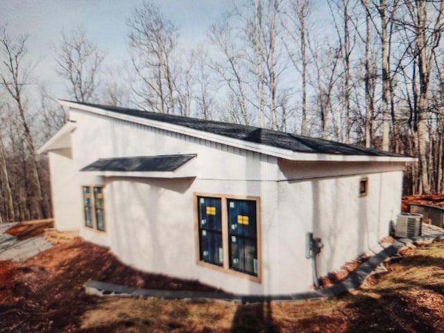 view of home's exterior featuring cooling unit