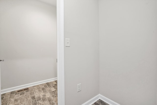 interior space featuring baseboards