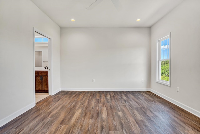 empty room with wood finished floors, baseboards, recessed lighting, and a ceiling fan