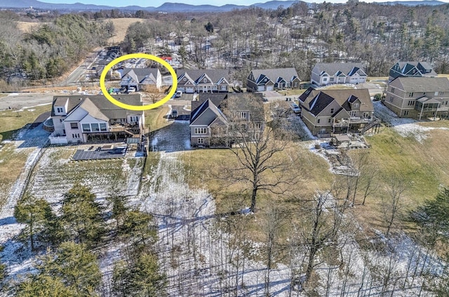 aerial perspective of suburban area with a mountainous background