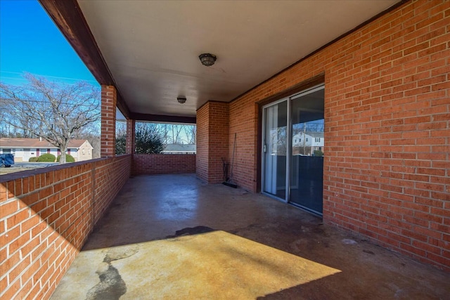 view of patio featuring a balcony