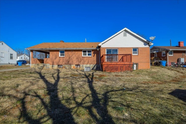 rear view of property with a lawn