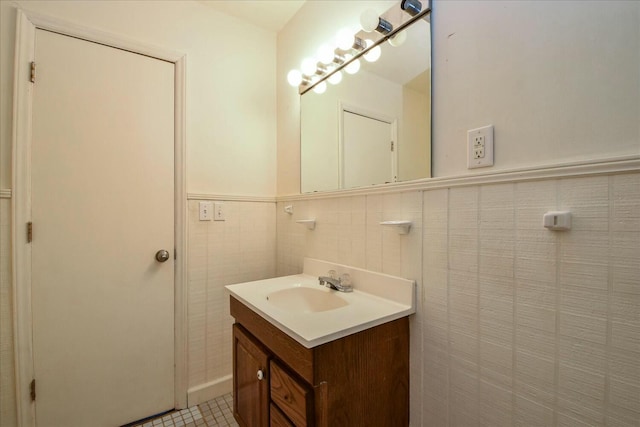 bathroom featuring vanity, tile walls, and tile patterned floors