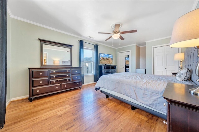 bedroom featuring ornamental molding, ceiling fan, and light wood-type flooring