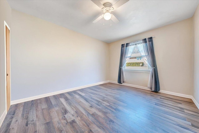 spare room with wood-type flooring and ceiling fan