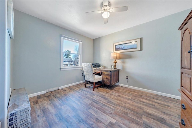 office area with dark hardwood / wood-style flooring and ceiling fan