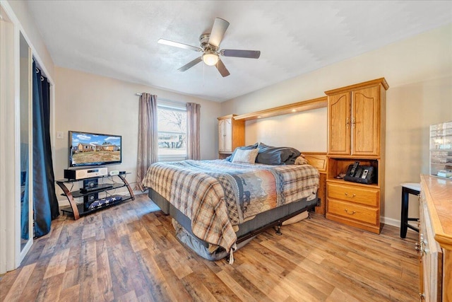 bedroom featuring light hardwood / wood-style flooring and ceiling fan